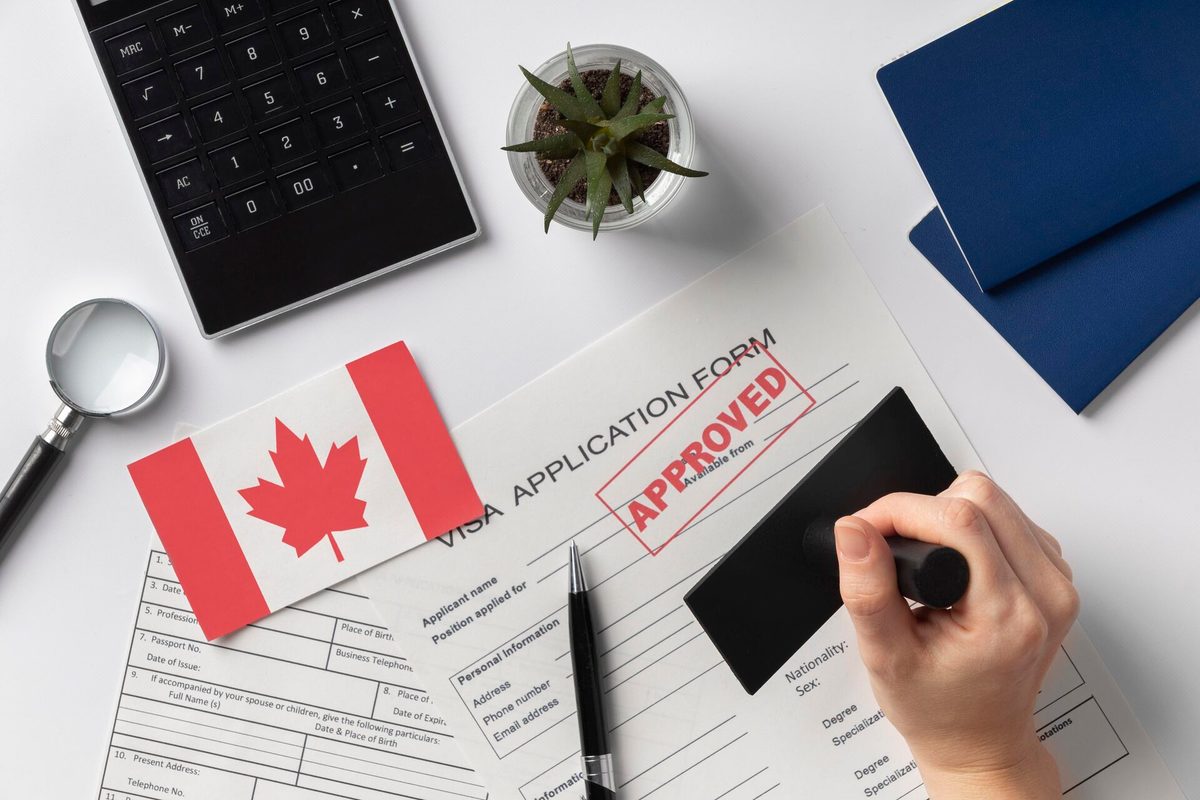 visa-application-composition-with-canadian-flag_136398